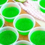 Green JELLO in small cups.