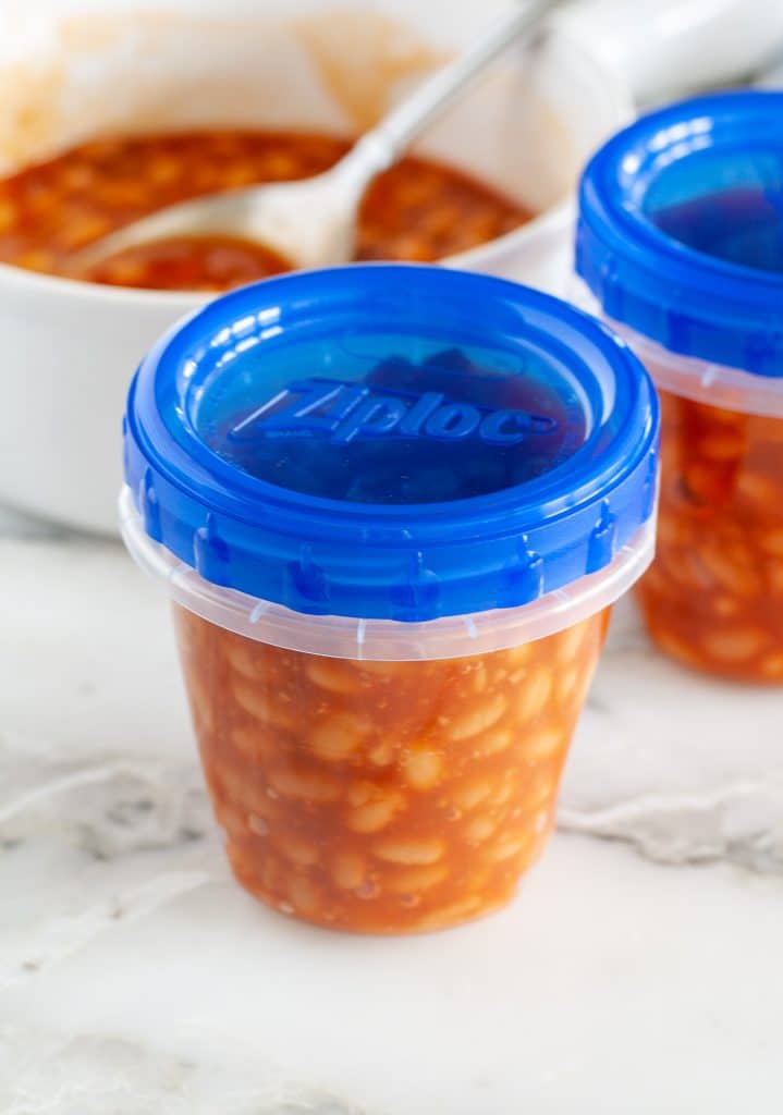 Plastic container with baked beans. 