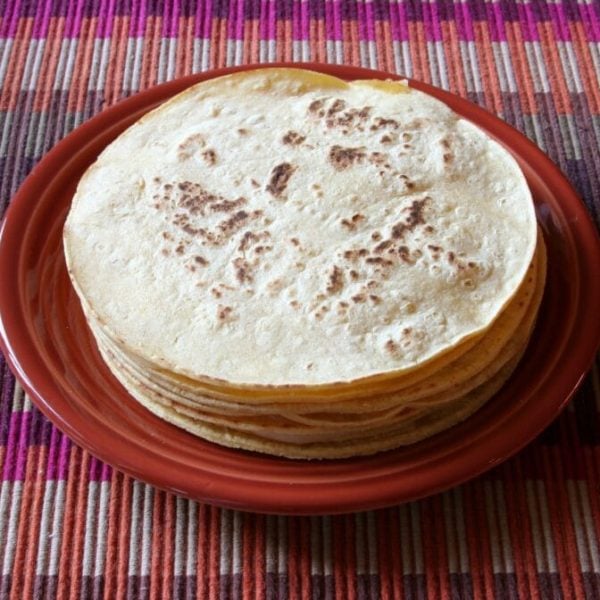 Stack of tortillas on a plate.