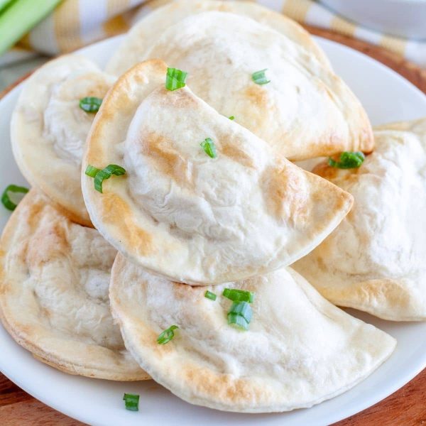 Plate full of pierogies.