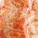 Steak covered in seasonings.