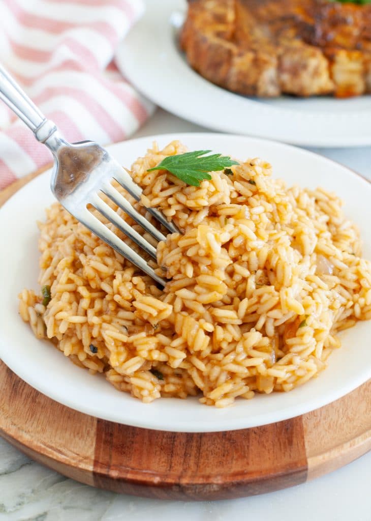 Fork going into rice. 