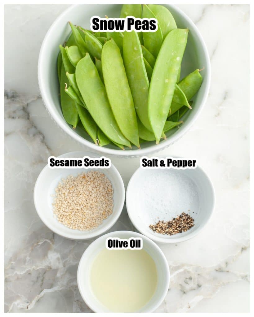 Bowl of snow peas, salt, oil and sesame seeds.