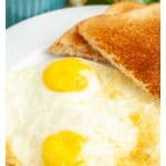 Plate with two eggs and toast.