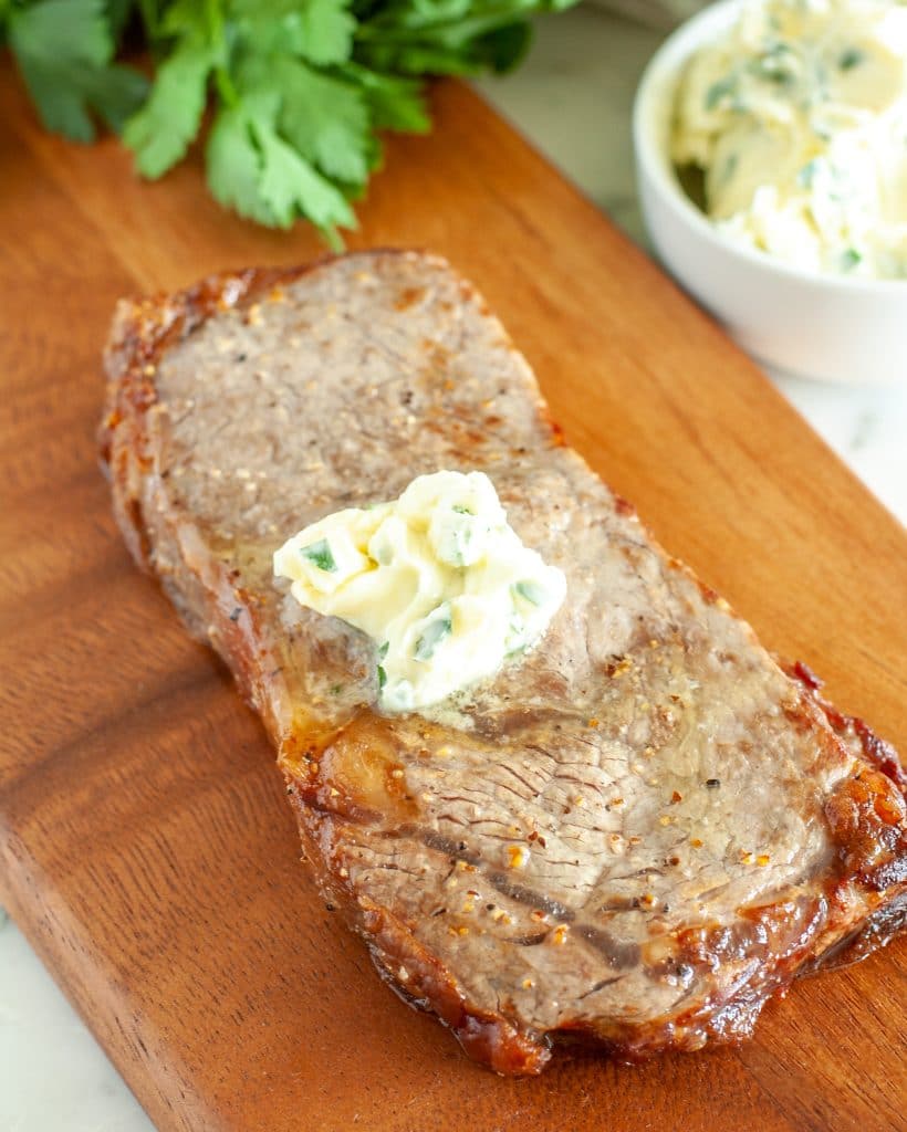 Steak on cutting board. 