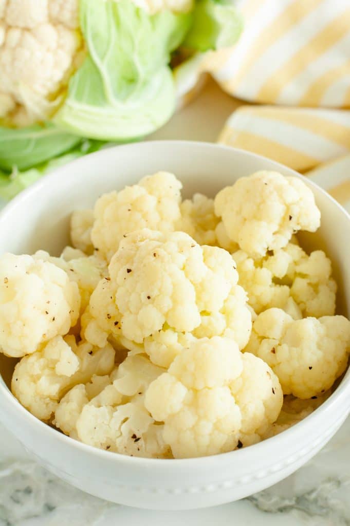 Bowl with steamed cauliflower florets. 