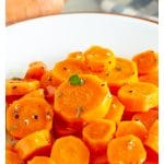 Plate with steamed carrots.