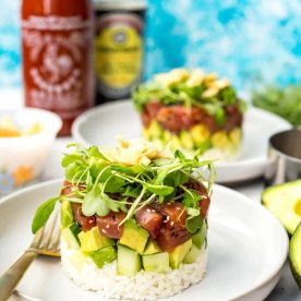 Ahi tuna chunks stacked on avocado and rice.