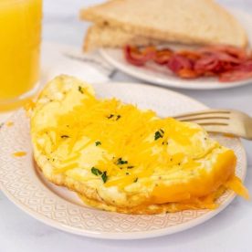 Cheesy omelette on a plate.