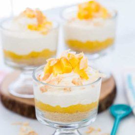 Layered mousse cups with diced mango.