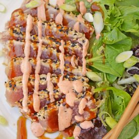 Sliced tuna with sauce.