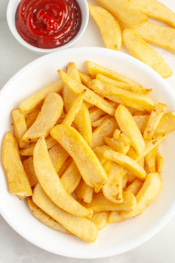 Bowl of cooked steak fries.