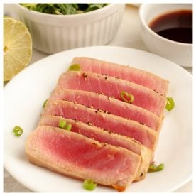 Sliced tuna on a plate.