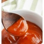 Bowl with sauce and a spoon.