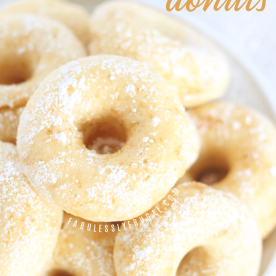 Donuts stacked on plate.