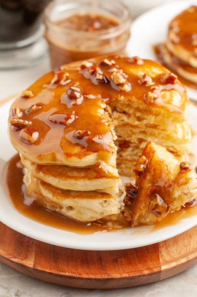 Stacked pancakes on plate.