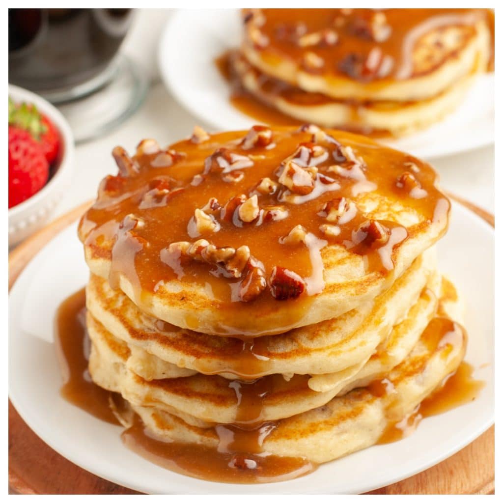 Stack of pancakes with a pecan syrup.