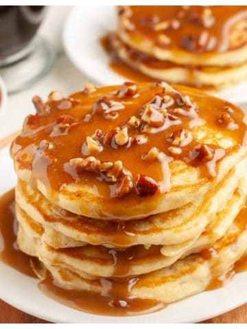 Stack of pancakes with a pecan syrup.