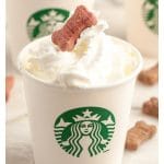 Starbucks cup with cream and dog treat.