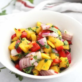 Bowl of diced mango, red onion, red pepper.