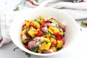 Bowl of diced mango, red onion, red pepper.