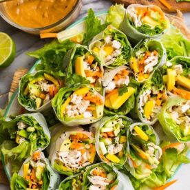 Stacked chicken filled lettuce rolls.