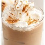 Glass with creamy drink.