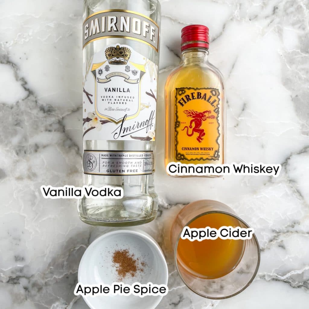 Bottle of vodka and whiskey, cider and apple pie spice.