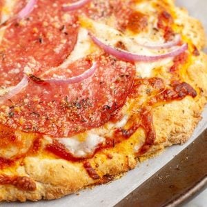 Cooked pizza on a pan.