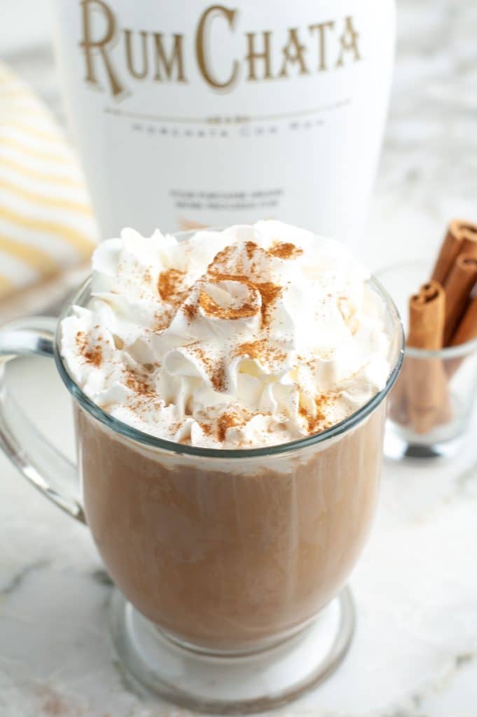 Coffee mug filled with coffee and cream.