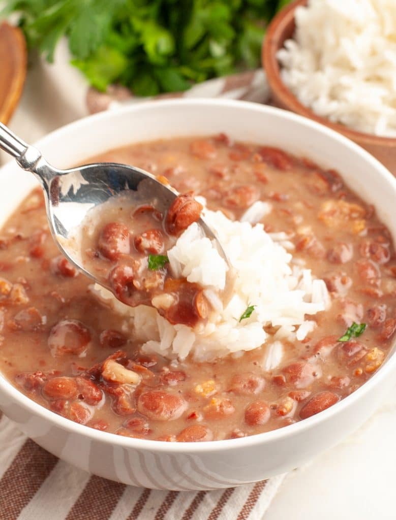 Spoon with bowl of beans. 