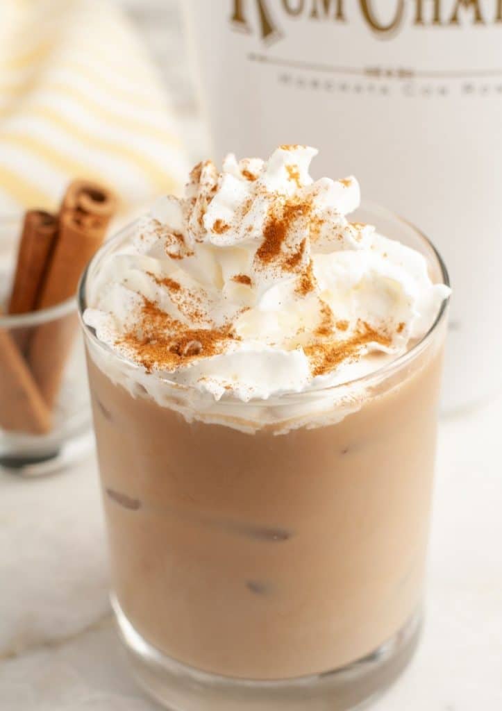 Iced coffee and whipped cream in glass.