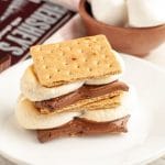 S'mores sitting on a stack of plates.