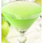 Apple martini in martini glass.