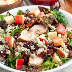Bowl of salad with chicken.