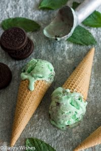 Two cones of mint Oreo Ice Cream lay flat on the counter