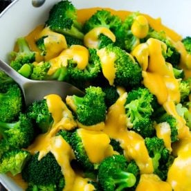 Broccoli with cheese sauce.