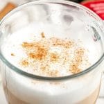 Glass filled with hot latte.