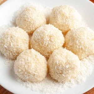 Plate of dessert balls with coconut.