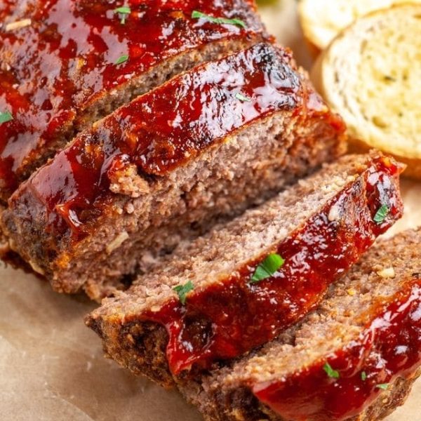 Sliced meatloaf on a plate.