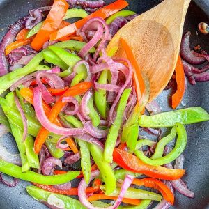 Skillet with peppers and onions.