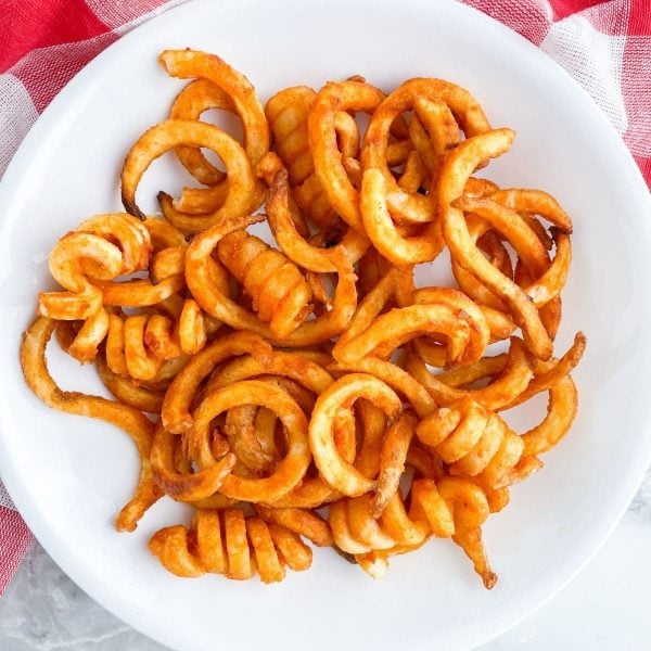 Bowl of curly french fries.