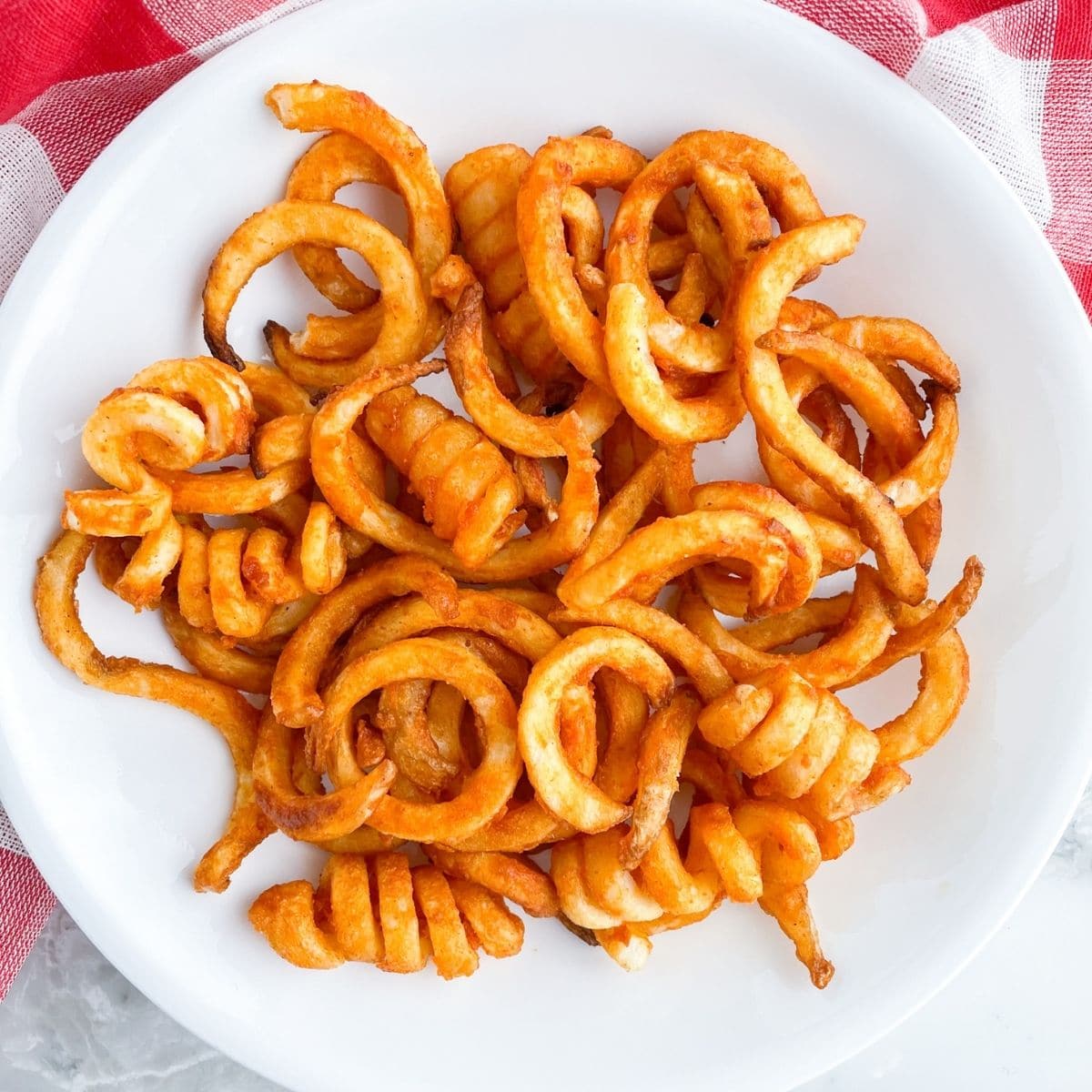 Spiced Crispy & Curly Sweet Potato Fries - Sprinkle of Green