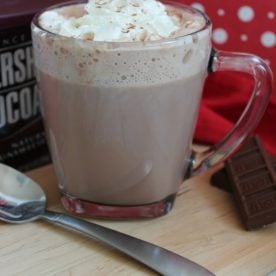 Mug of hot chocolate and whipped cream.