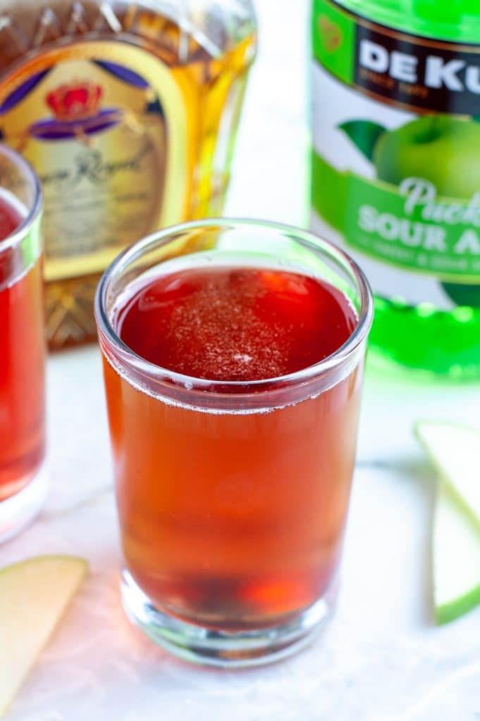 Glass filled with red drink. 