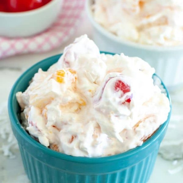 Blue bowl filled with ambrosia salad.