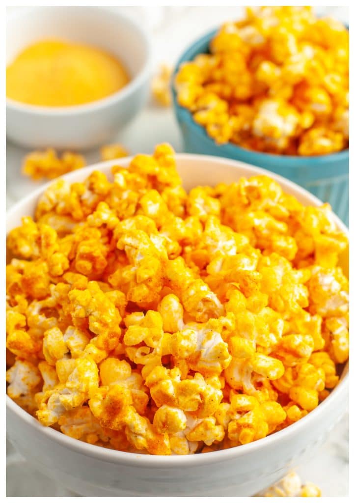 Bowl of popcorn with cheese powder.