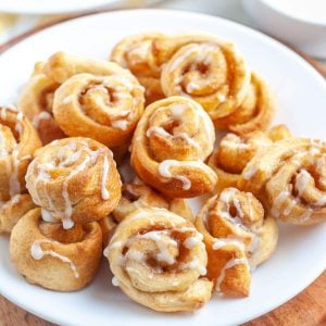 Small cinnamon rolls on a plate.