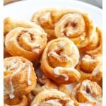Plate of small cinnamon rolls.