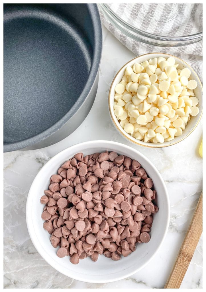 Bowls of chocolate chips and white chocolate chips.